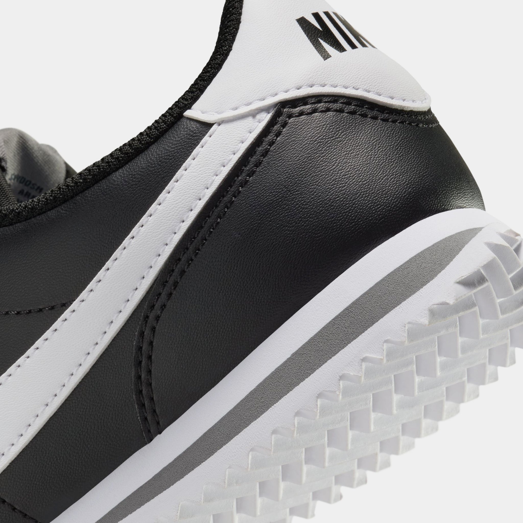 black and white leather cortez