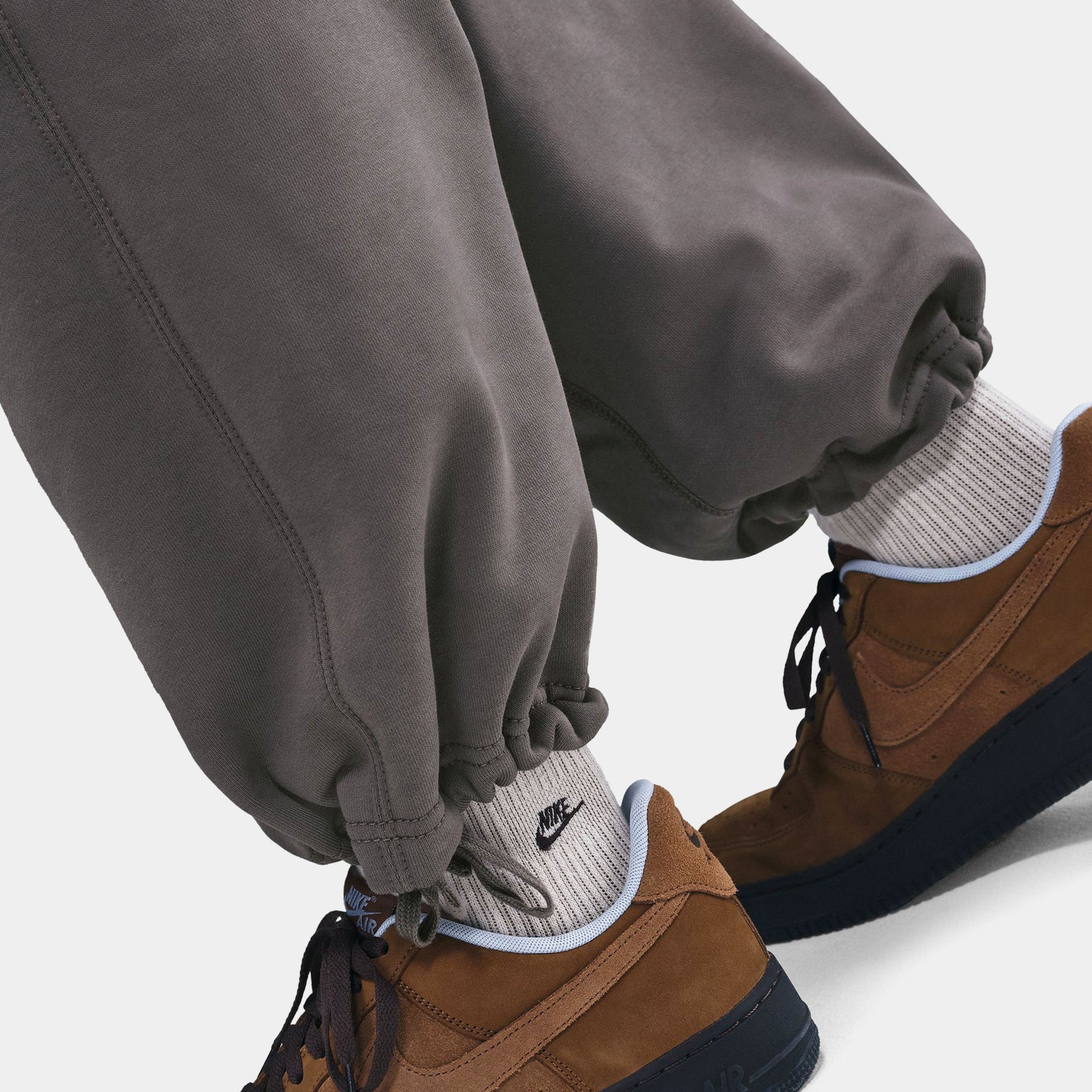 nike club joggers stone