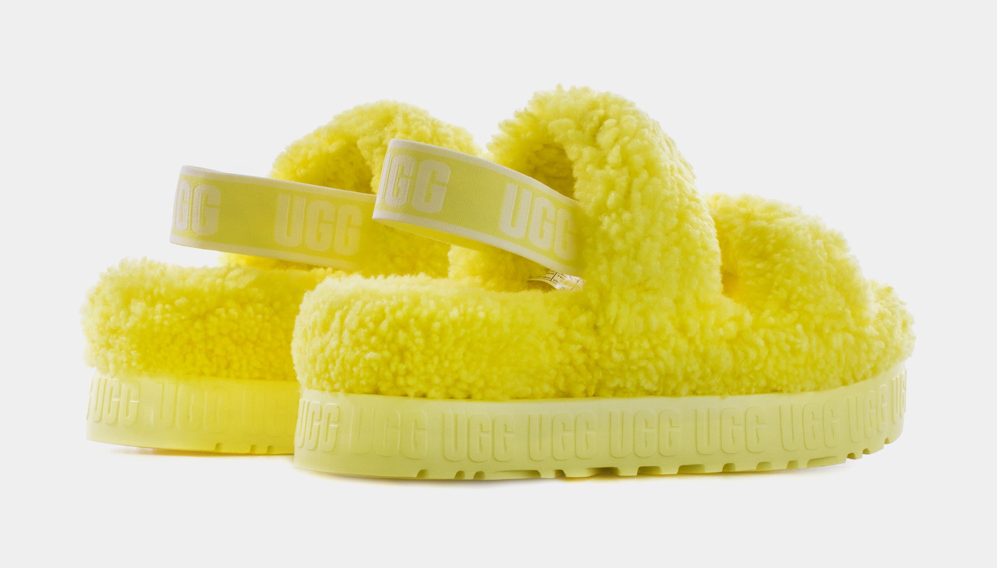 UGG Fuzzette cross strap fluffy slippers in yellow | ASOS